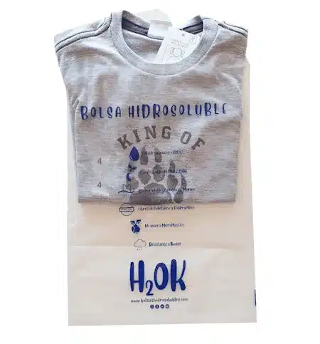 Water soluble PVOH film for self adhesive textile packaging bags